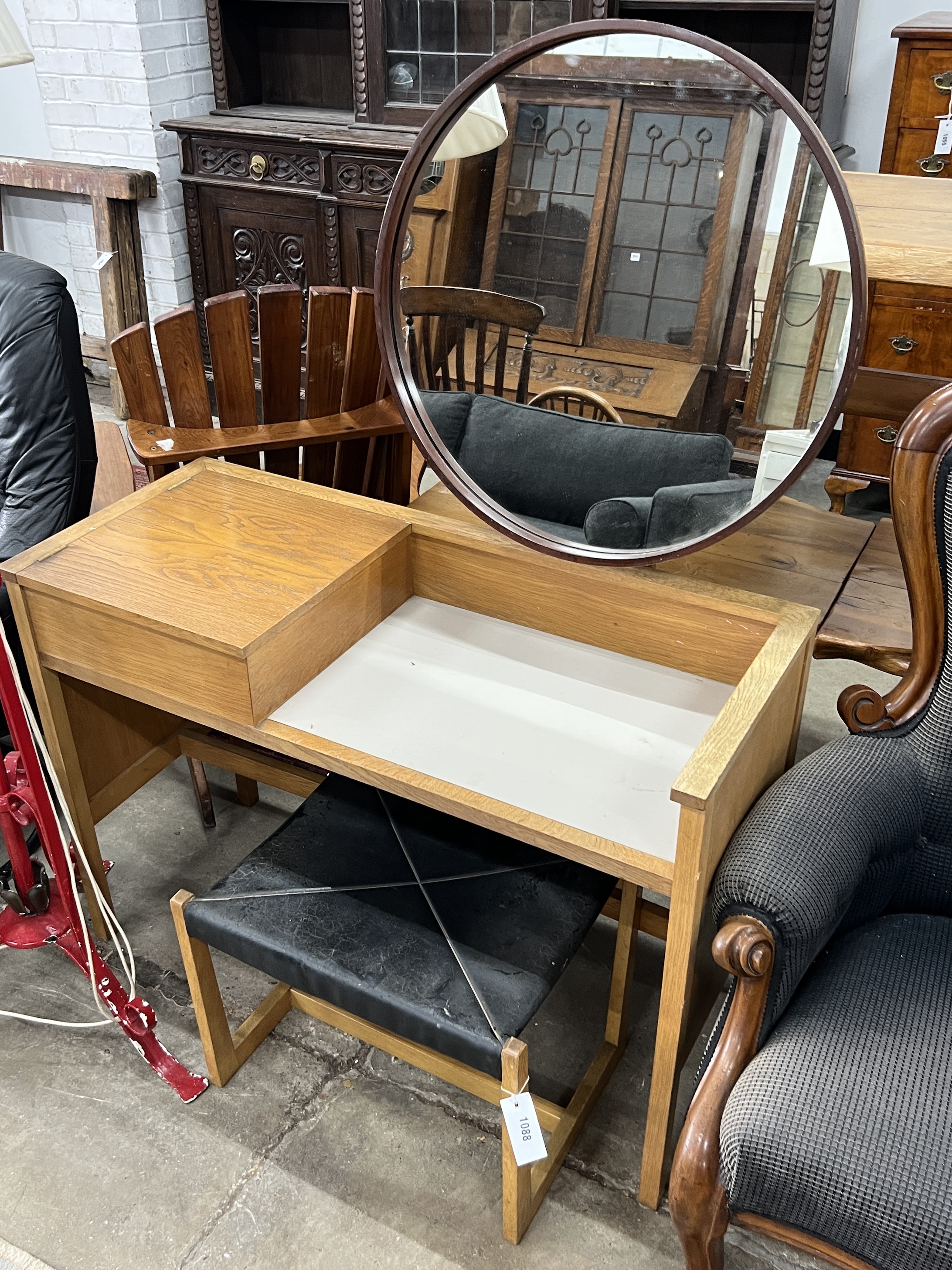 A G-Plan oak and teak dressing table, width 102cm, depth 42cm, height 136cm and an initialled stool